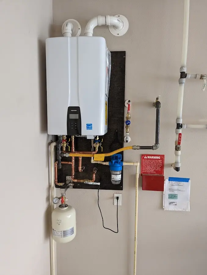 Professional plumber installing copper piping in a Garden Grove home